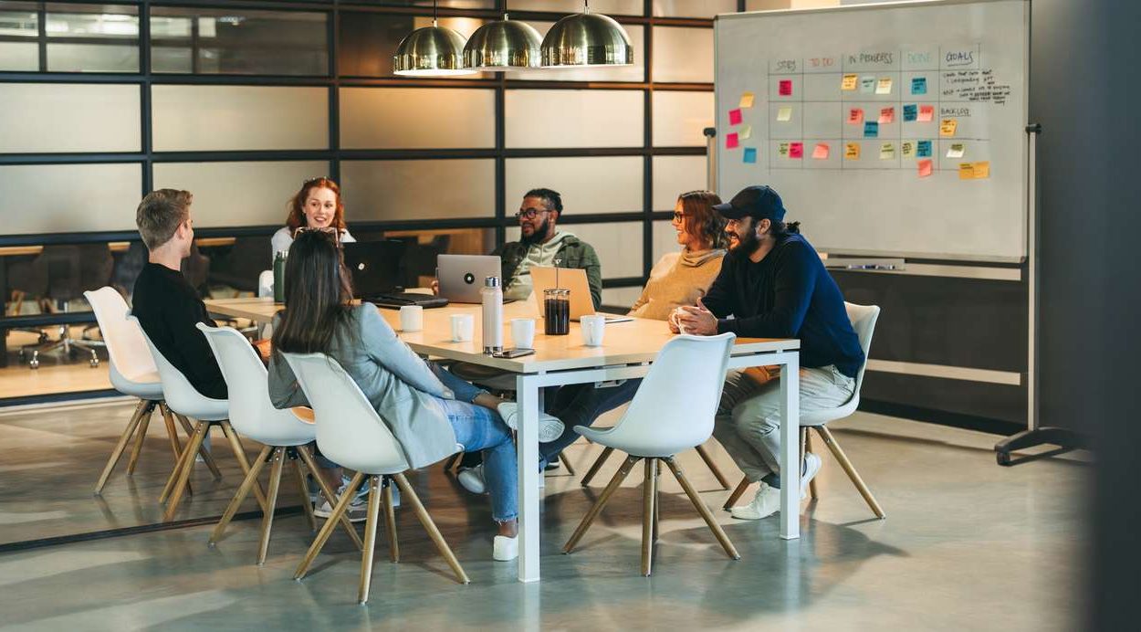 Team office meeting: Innovating solutions for software development in a tech company