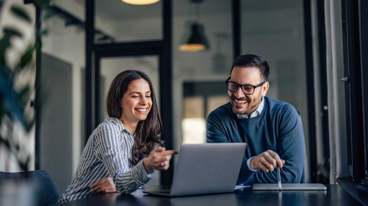 Smiling people, in the meeting room, using a laptop, searching