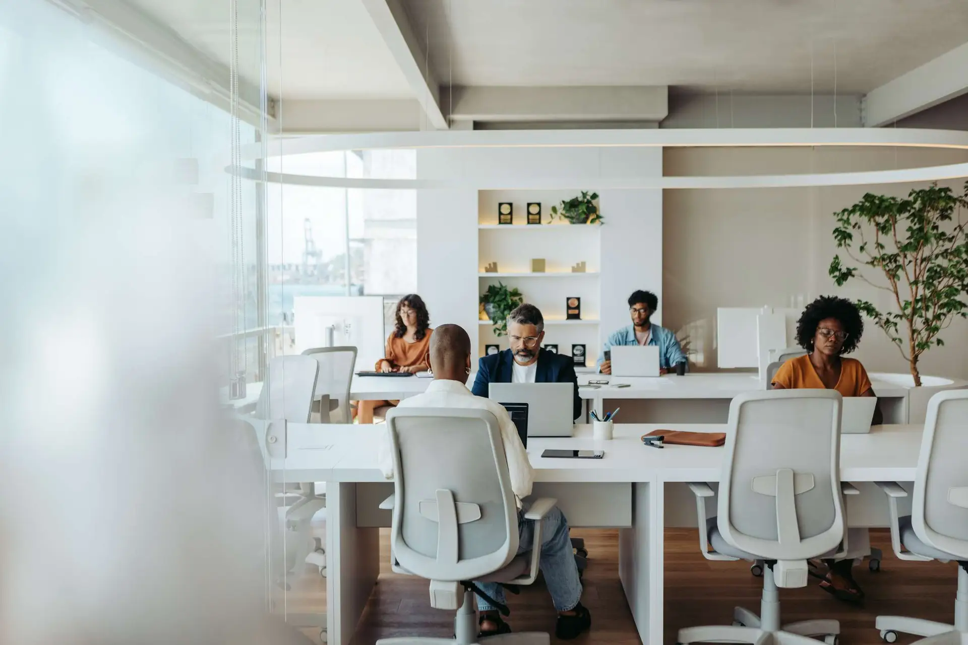 Multicultural colleagues working together in a creative coworking office