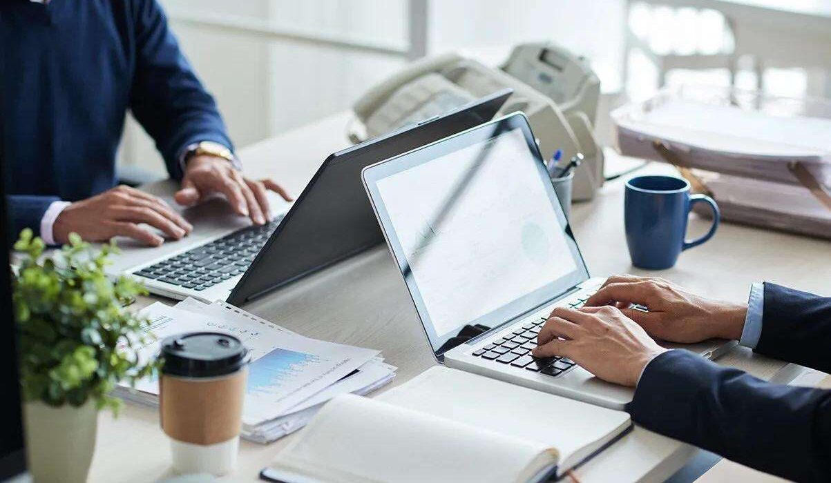 employees typing in their laptop during working hours