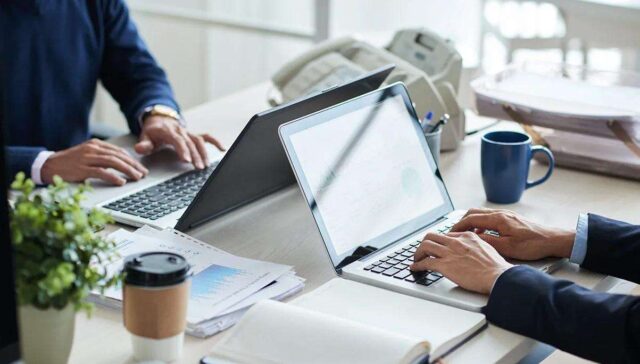 employees typing in their laptop during working hours