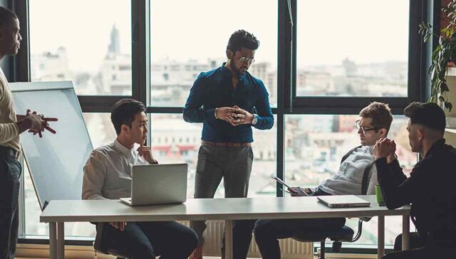 office collague thinking seriously in meeting room about data breach