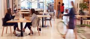 people sitting and walking in reception area