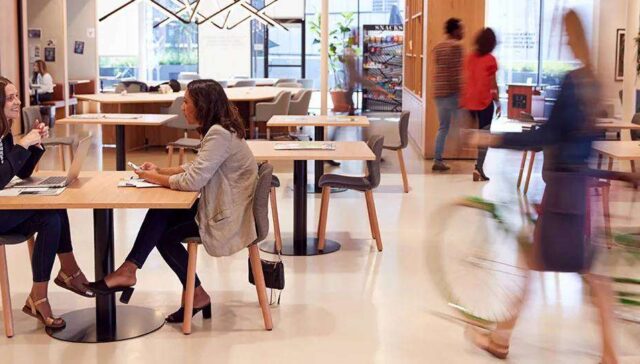 people sitting and walking in reception area