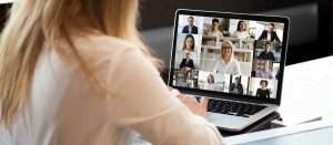 a women attending zoom call with their collague