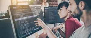 technical professionals watching codes in system