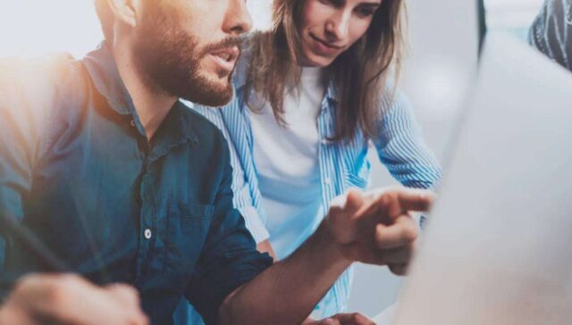 a men sharing some points with their women colleague in office
