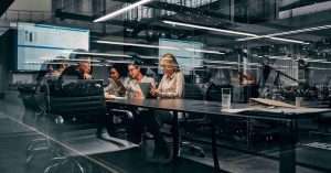 employees working in a glass covered office