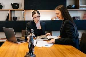 Consulting business woman lawyer or judge consultant holding a meeting with a client, concept of justice, consultation, and legal services