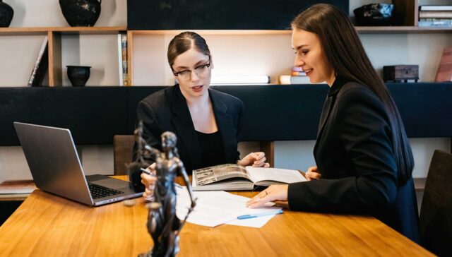 Consulting business woman lawyer or judge consultant holding a meeting with a client, concept of justice, consultation, and legal services