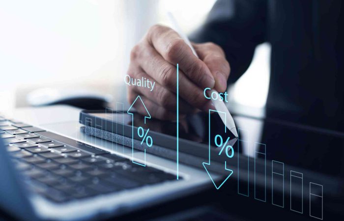 Cost and quality control, business strategy and project management concept. Businessman working on digital tablet with quality control growth graph and cost reduction, effective business