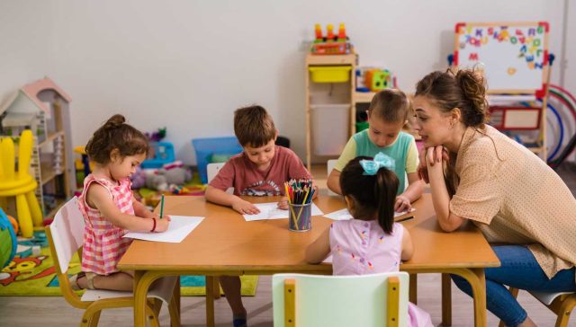 Kids with teacher in day care