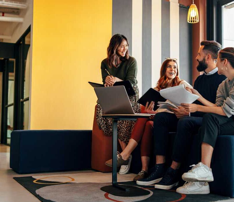 Multicultural businesspeople working in an office lobby