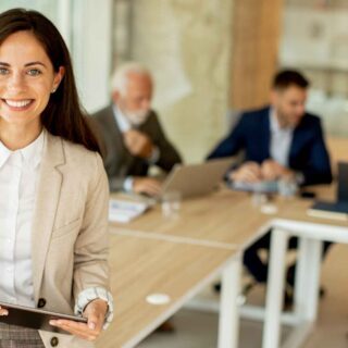Young woman with digital tablet in the office