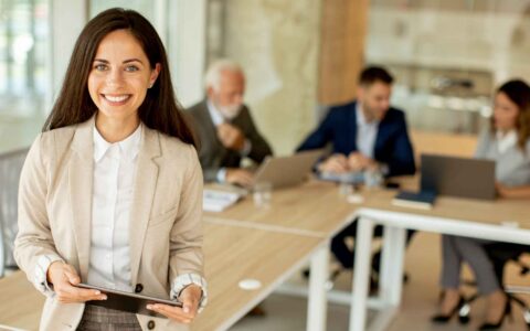 Young woman with digital tablet in the office