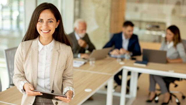 Young woman with digital tablet in the office