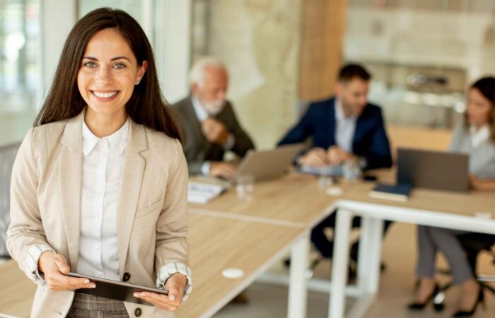 Young woman with digital tablet in the office