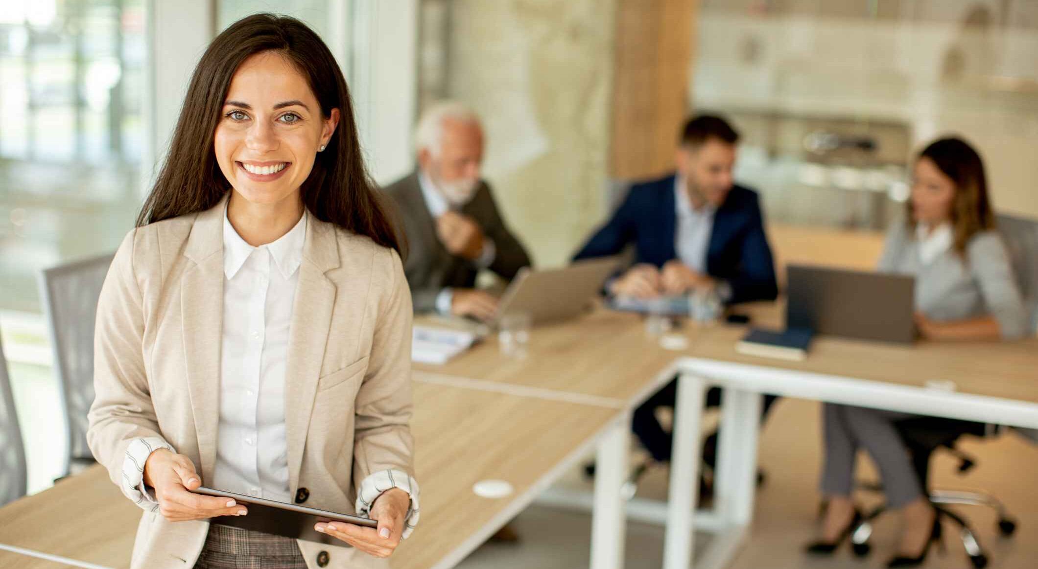 Young woman with digital tablet in the office