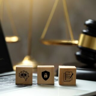 AI ethics and AI Law concept. wooden cube with AI icons on the laptop and a judicial gavel . artificial intelligence law and online technology of legal law regulations. AI technology group control .
